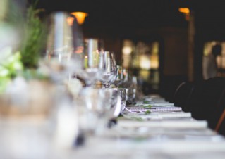 Detail shot of a long, festive restaurant table.