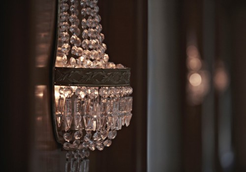 Classic wall chandeliers in a hotel setting